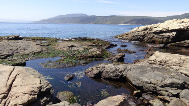 istock Landscape of rock formations and rocky beach 1051345818