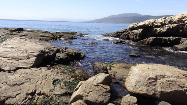 istock Landscape of rock formations and rocky beach 1051345994