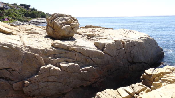 istock Landscape of rock formations and rocky beach 1051348074