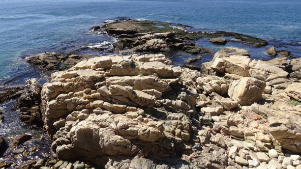 istock Landscape of rock formations and rocky beach 1051348168