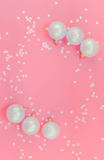 istock Christmas pink flat lay pattern with pearl balls 1051360558
