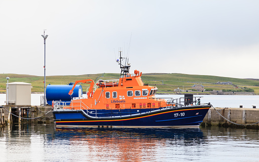 Lerwick, Shetland Islands - September 8, 2015:  A Royal National Lifeboat Institution (RNLI) lifeboat is seen moored in the port of Lerwick on the Shetland Islands, Scotland.