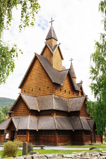 Old Stave church Heddal Heddal, Norway-August 15, 2014 -  Old Stave church and cemetery in Norwegian village. heddal stock pictures, royalty-free photos & images