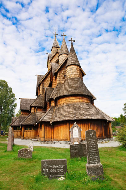 Old Stave church Heddal Heddal, Norway-August 15, 2014 -  Old Stave church and cemetery in Norwegian village. heddal stock pictures, royalty-free photos & images