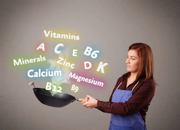 istock Young woman cooking vitamins and minerals 1051367452