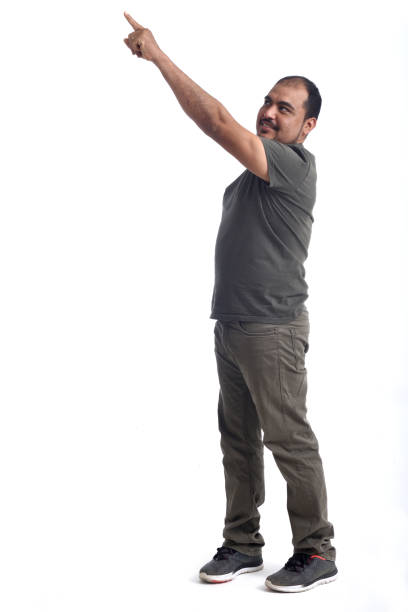 full portrait of a latin man pointing on white background
