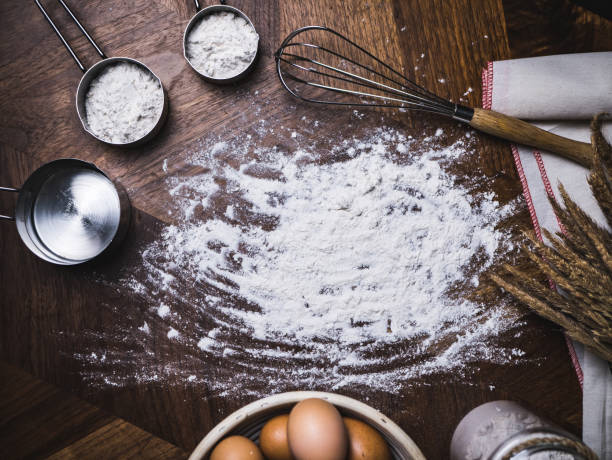 Pastry Baking Accessories Bakery Background with flour and whisk. Ingredients for the preparation of bakery products.