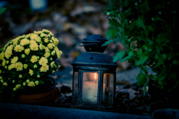 istock burning candle during All Saints Day 1051372184