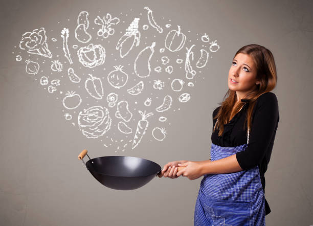 istock Woman cooking vegetables 1051375938