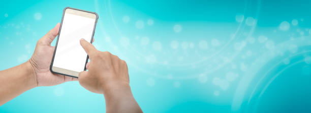 istock hand holding and press smart phone 1051376060