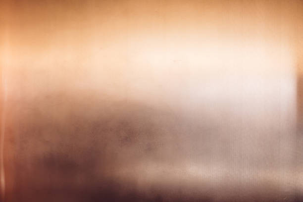 istock Art deco style shiny glossy copper clad wall with light reflection. Texture backround 1051379762