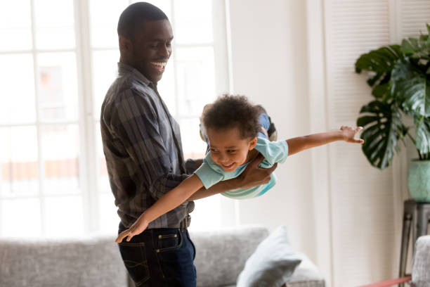 istock Loving dad with little son have a fun at home 1051381232