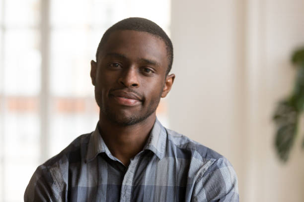 istock Confident black man looking at camera indoors 1051381614