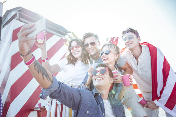 istock Positive delighted students having party on rooftop 1051385028