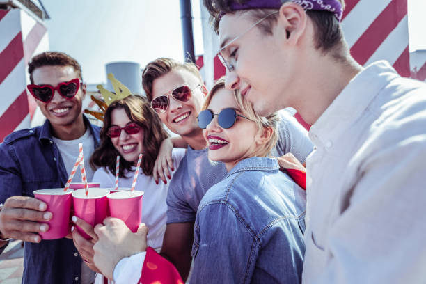 istock Positive delighted students having party on rooftop 1051385048