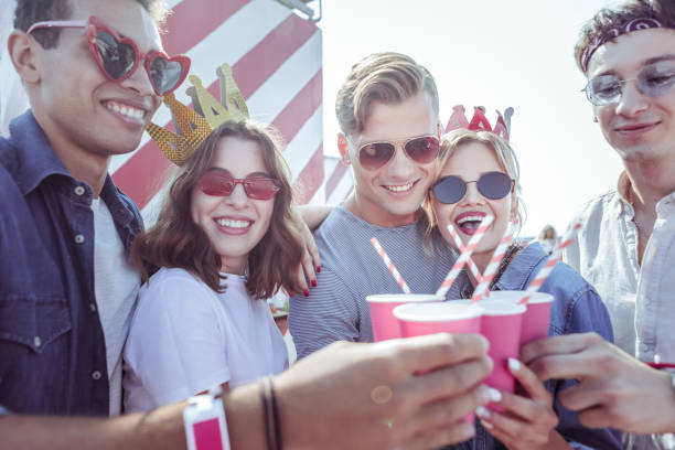istock Cheerful brunette girl having paper crown on head 1051385142
