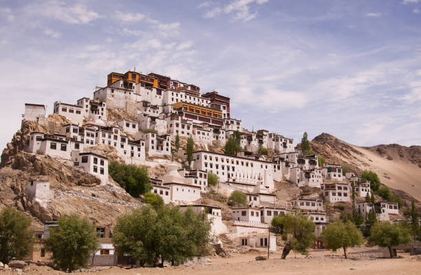 istock Scenic view on ancient buddhist monastery in himalayas with cloudy blue sky background. Region Ladakh. State Jammu and Kashmir. India. 1051385318