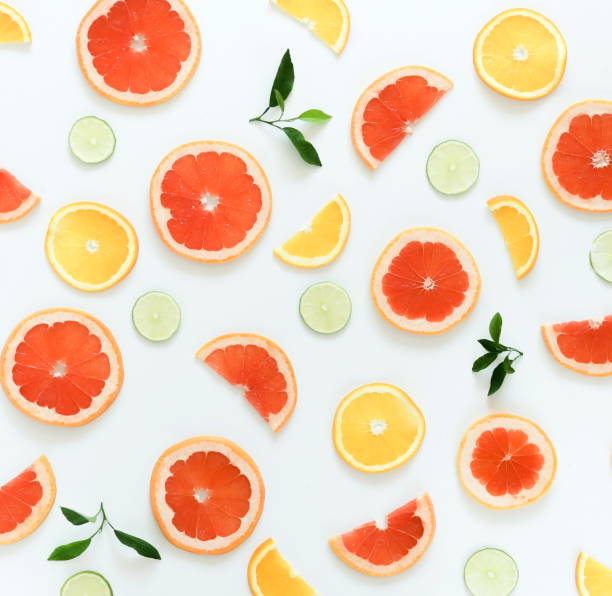 istock Citrus fruits pattern composition top view background. Lime, grapefruit, orange,   on white background. Summer food concept. Flat lay, 1051385724