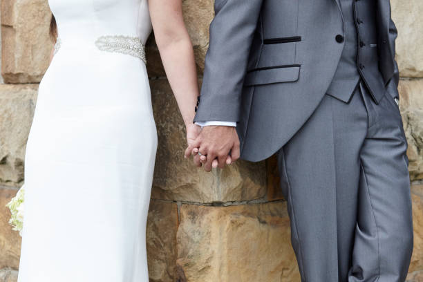 bride and groom holding hands - haute couture beautiful smoking beauty imagens e fotografias de stock