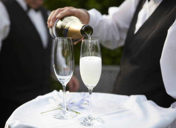 istock Waiter pouring champagne 1051386512
