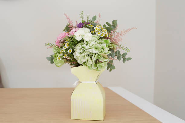 istock Fancy flower bouquet in cardboard packaging 1051386718