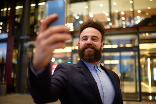 istock Male hipster person capturing selfie image 1051386900
