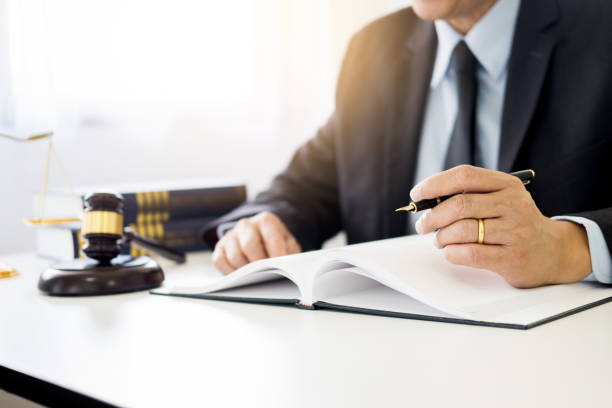 istock Midsection Of Lawyer Working On Table 1051389304