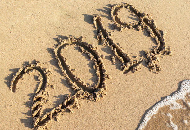 istock 2019 written on sand at sea beach. 1051389454