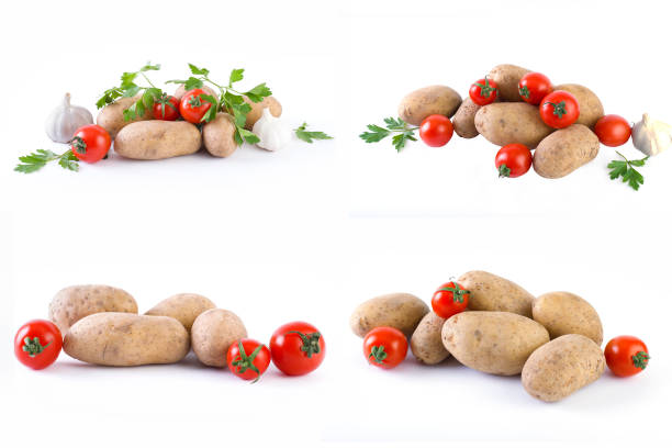 Potatoes and tomatoes on a white background. Potatoes on a white background. Red tomatoes with potatoes