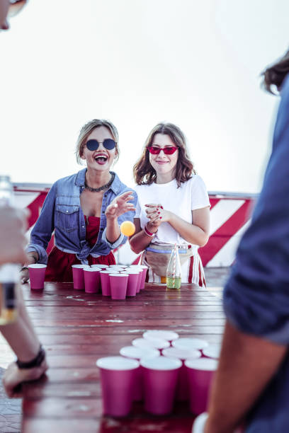 istock Emotional young blonde girl playing table game 1051391140
