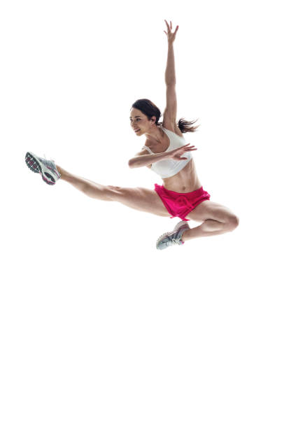 istock Beautiful athletic woman jumping 1051394784