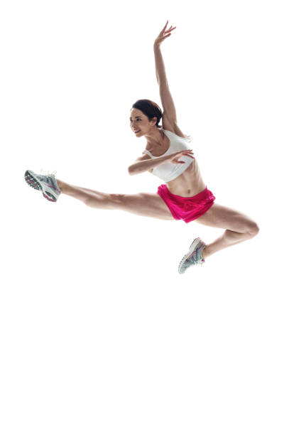 istock Beautiful athletic woman jumping 1051394796