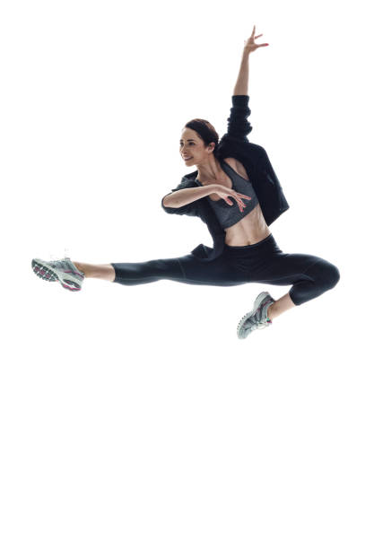 istock Beautiful athletic woman dancing in midair 1051394950