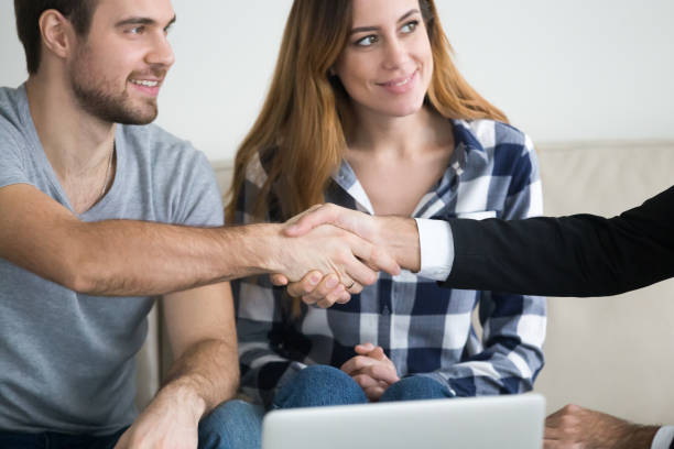 istock Millennial couple handshake consultant overcoming therapy session 1051395328