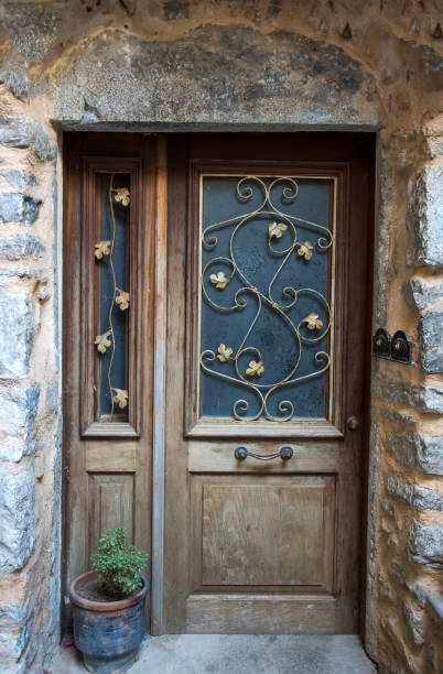 istock Old door, wooden and wall texture background 1051398630