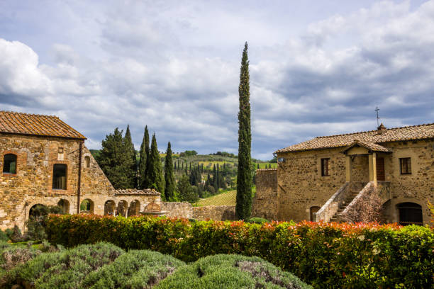 Monastery in Tuscany lonely medieval monastery in the Tuscan hills agritourism stock pictures, royalty-free photos & images