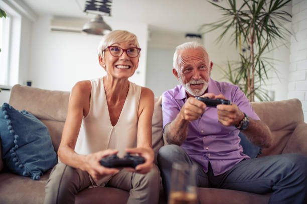 istock Senior couple having great time together, playing video game 1051409218