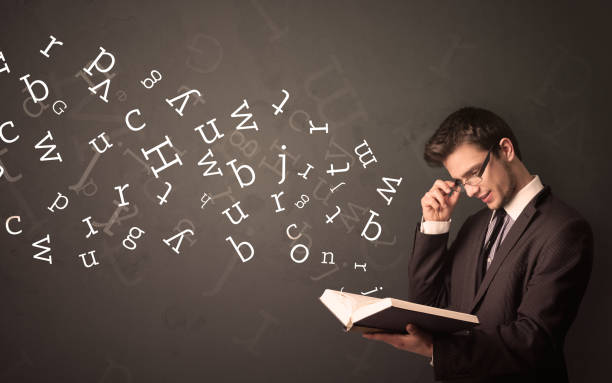 istock Young man holding book with letters 1051409684