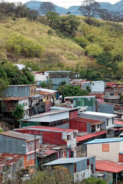 istock shacks in San Jose, between banana trees 1051414126