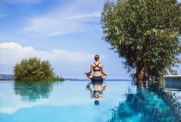 istock Woman is practicing yoga outdoors. Meditation and harmony concept 1051414244