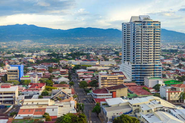San Jose Costa rica San Jose Costa rica capital city street view with mountains in the back costa rica photos stock pictures, royalty-free photos & images