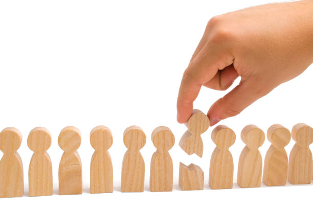 istock The concept of a weak link. Helping people with special needs. Rehabilitation and assistance. Equality. The hand connects the two parts of the person together. 1051421082