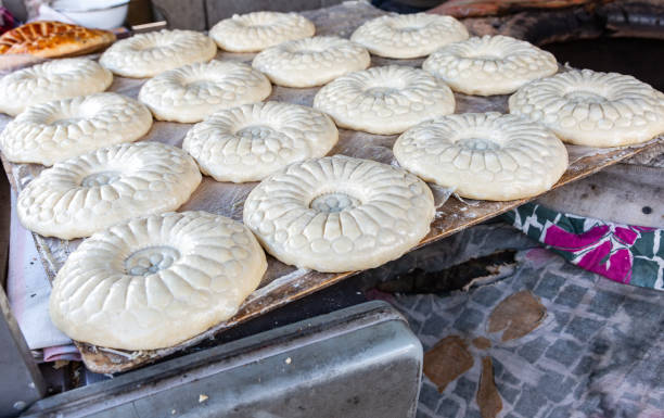 istock Uzbek flatbread is preparing to put in the tandyr 1051427740