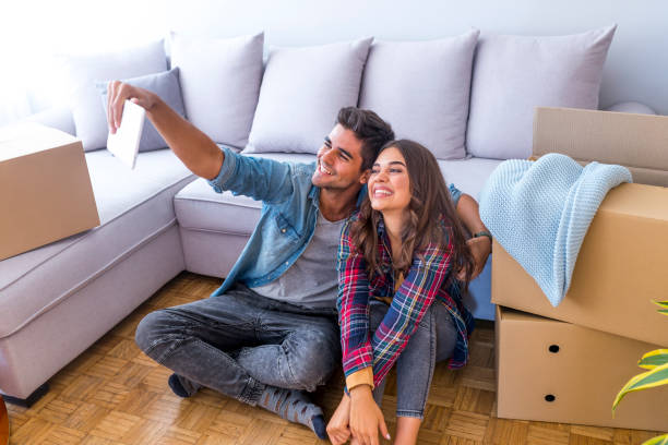 istock Young couple moving to a new apartment together relocation 1051430950