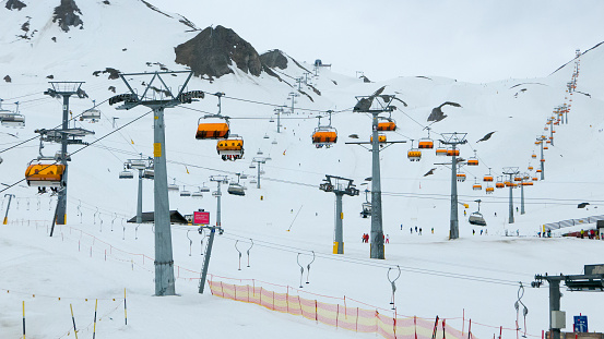 Multiple skilifts operating in alpine ski resort