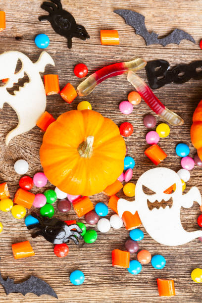 istock Colorful halloween candies on wood 1051435724