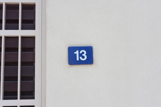istock number 13 sign on the wall, bad luck 1051438860