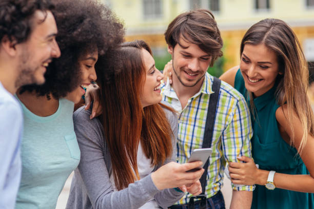 istock Friends laughing at funny message 1051438950