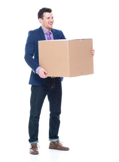 istock Businessman holding a cardboard box 1051439286