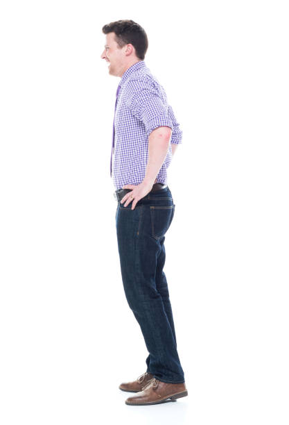 istock Handsome businessman standing with hands on hips 1051442204